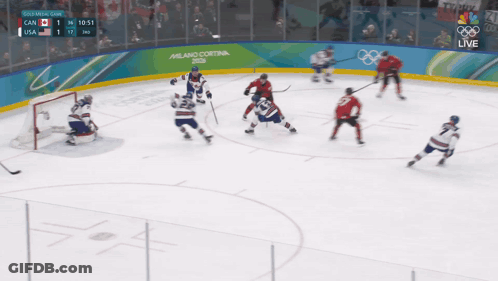 Hockey Game In Front Of Milano Cortina Sign GIF