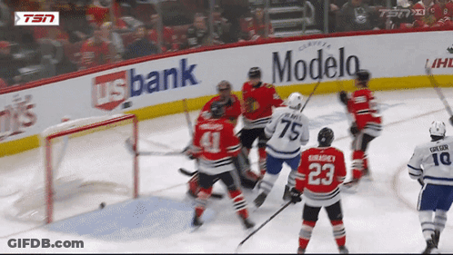 Hockey Game In Front Of Modelo Sign GIF