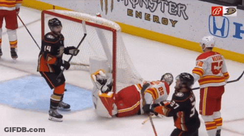 Hockey Game In Front Of Monster Energy Banner GIF