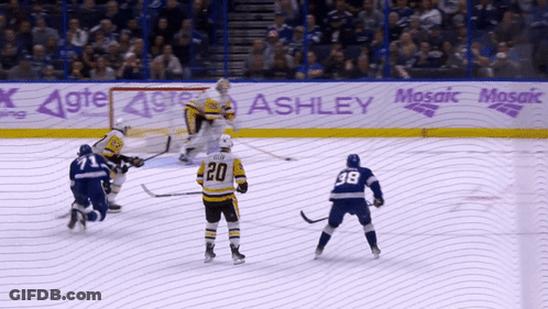 Hockey Game In Front Of Mosaic Advertisement GIF
