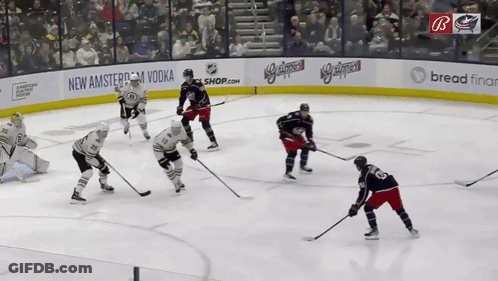Hockey Game In Front Of New Amsterdam Vodka Shop Banner GIF