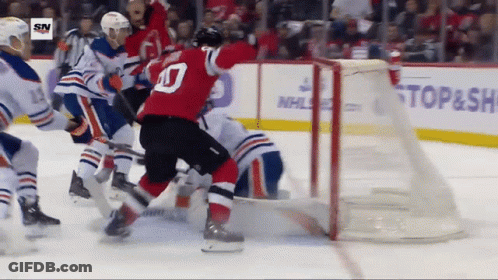 Hockey Game In Front Of NHL Banner GIF