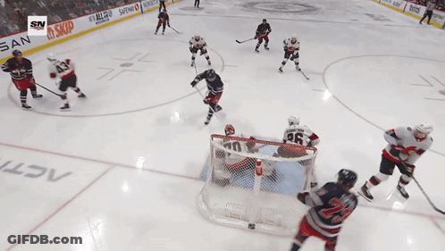 Hockey Game In Front Of Nissan Banner GIF