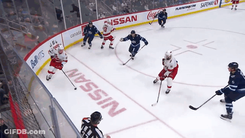 Hockey Game In Front Of Nissan Sign GIF