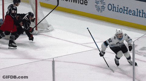 Hockey Game In Front Of Ohio Health Ad GIF