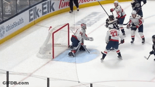 Hockey Game In Front Of Ohio Health Banner GIF