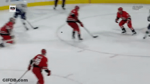 Hockey Game In Front Of Progressive Banner GIF