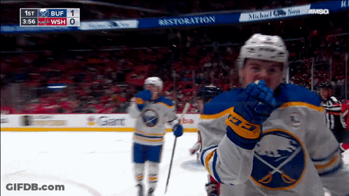 Hockey Game In Front Of Restoration Sign GIF