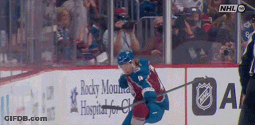 Hockey Game In Front Of Rocky Mountain Hospital Sign GIF