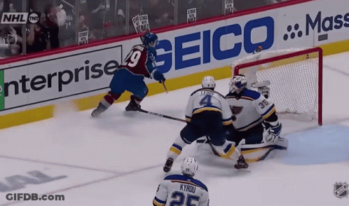 Hockey Game In Front Of Seico Ad GIF