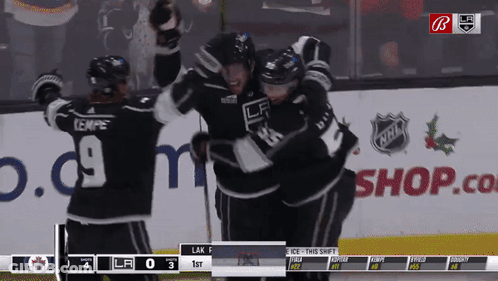 Hockey Game In Front Of Shop.com Sign GIF