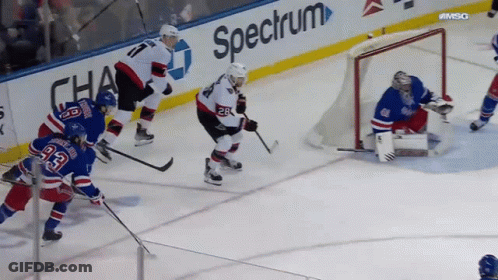Hockey Game In Front Of Spectrum Ad GIF