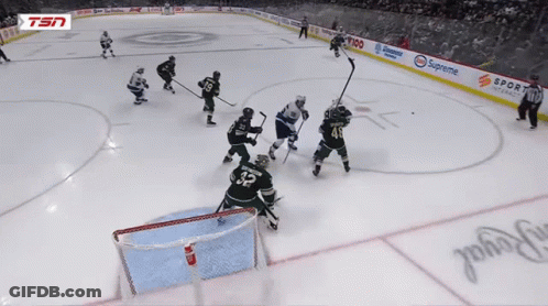 Hockey Game In Front Of Supreme Ad GIF