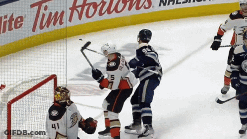 Hockey Game In Front Of Tim Hortons Ad GIF