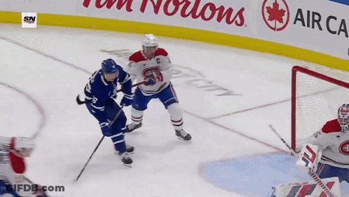 Hockey Game In Front Of Tim Hortons Sign GIF