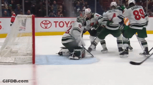 Hockey Game In Front Of Toyota Sign GIF