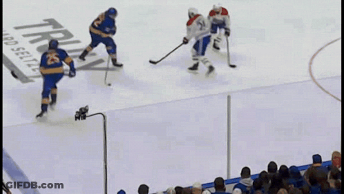 Hockey Game In Front Of Truly Hard Seltzer Ad GIF