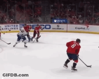 Hockey Game In Front Of United Airlines Ad GIF