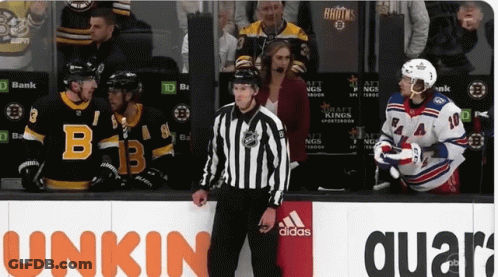 Hockey Game In Front Of Unkin Quartz Sign GIF