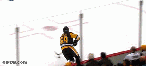 Hockey Game In Front Of Verizon Banner GIF