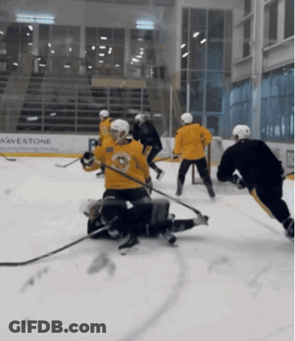 Hockey Game In Front Of Wavestone Sign GIF