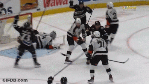 Hockey Game In Front Of Wawa Sign GIF