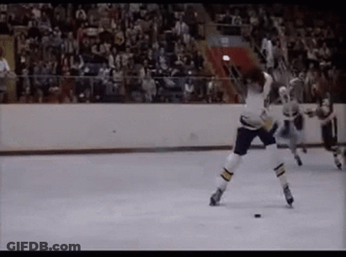 Hockey Game On Rink With Crowd GIF