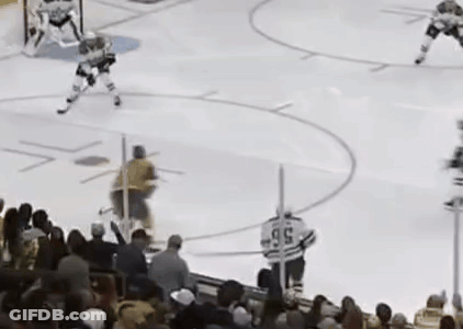Hockey Game On Rink With Crowd GIF