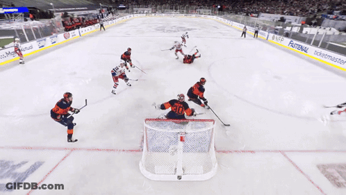 Hockey Game With Cat Ad On Ice GIF