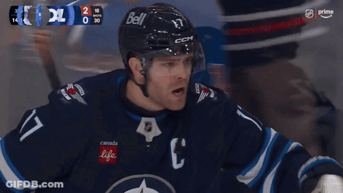 Hockey Game With Goal Shown On Screen GIF