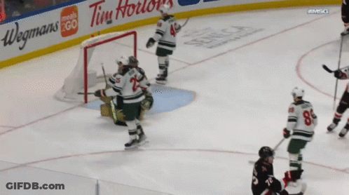 Hockey Game With Tim Hortons And Wegmans Ads GIF