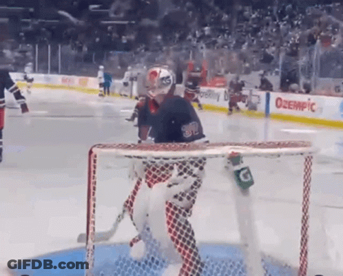 Hockey Goalie In Front Of Net With Gatorade Bottle GIF