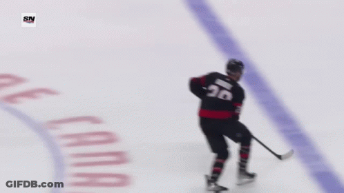 Hockey Goalie In Front Of Tim Hortons Banner GIF