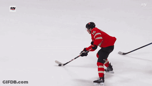Hockey Goalie In Yellow Jersey Number 32 GIF