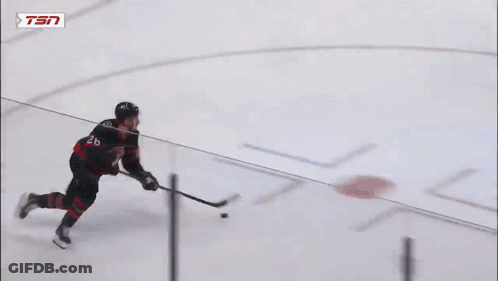 Hockey Goalie Kneeling In Front Of Tim Hortons Sign GIF
