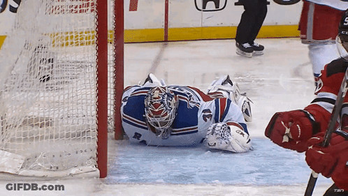 Hockey Goalie Laying On Ice With CCM Glove GIF