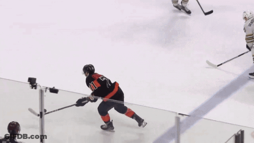 Hockey Goalie With B Jersey In Front Of KDL Ad GIF