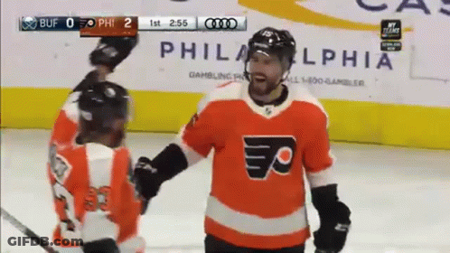 Hockey Goalie With Letter B Jersey In Front Of KDL Advertisement GIF