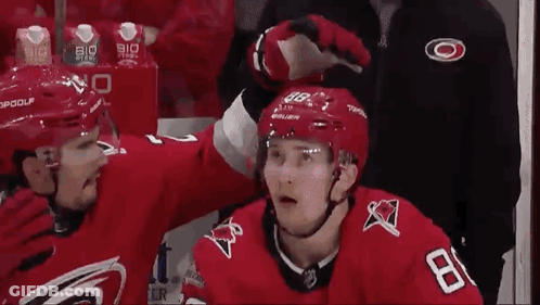 Hockey Player 18 Next To Another Player GIF