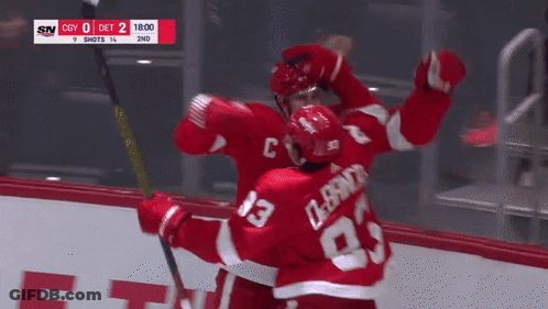 Hockey Player #23 Hugging Another Player GIF
