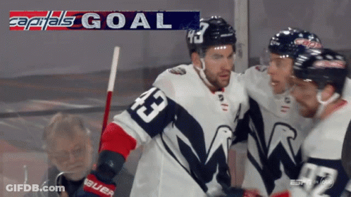Hockey Player 43 Surrounded By Teammates GIF
