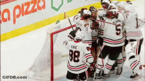 Hockey Player 98 Surrounded By Teammates GIF