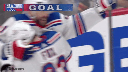 Hockey Player Celebrating Goal In Front Of New York Banner GIF