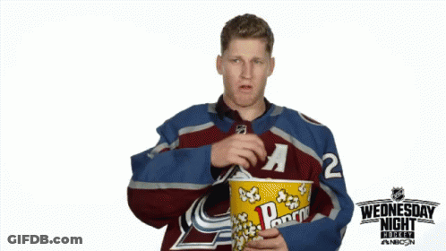 Hockey Player Eating Popcorn GIF