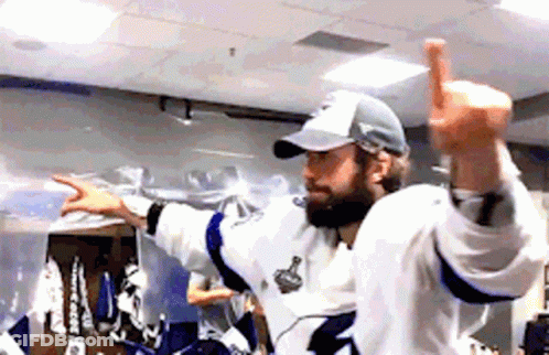 Hockey Player Giving Thumbs Up In Locker Room GIF