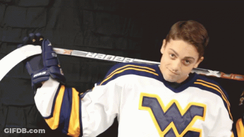 Hockey Player Holding Bauer Hockey Stick Over Shoulder GIF