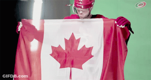 Hockey Player Holding Canadian Flag In Front Of Green Screen GIF