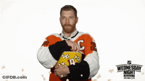 Hockey Player Holding Popcorn Wednesday Night Sign GIF