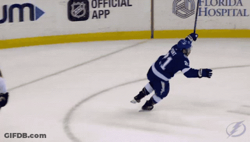 Hockey Player Holding Puck GIF
