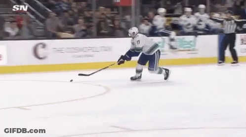 Hockey Player Holding Puck GIF